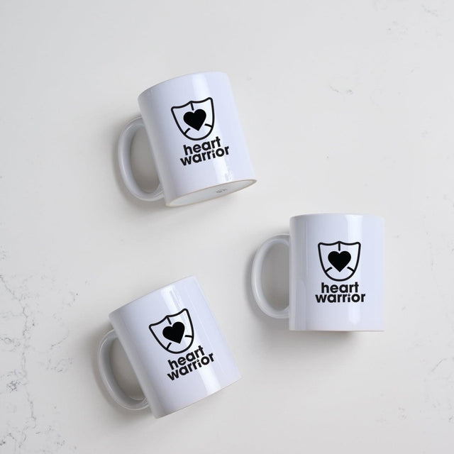 Heart Foundation white ceramic mug with heart warrior print in  black 